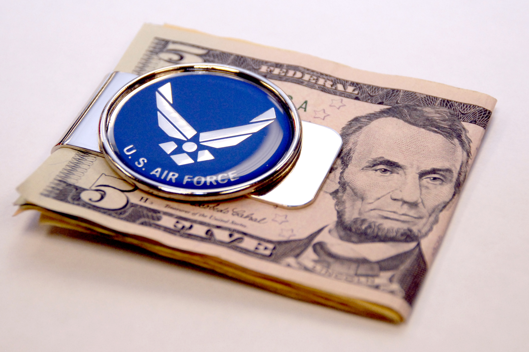 5 dollar bill inside of an Air force money clip