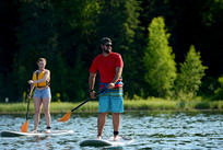 2 people paddle boarding