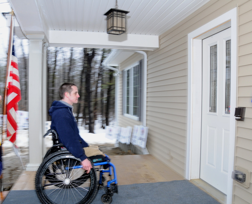 Veteran in a wheelchair on his porch