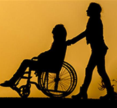 A person being pushed in a wheel chair