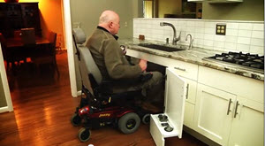 vet in a wheelchair at his sink