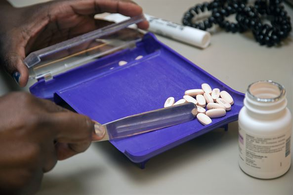 Pharmacist counting out a perscription