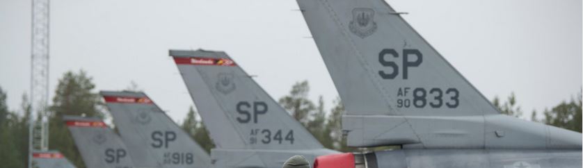 tails of aircraft lined up in a row