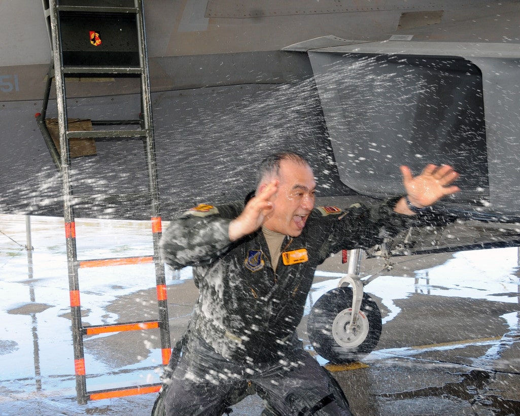 Pilot being sprayed with water
