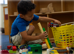 kid playing with toys