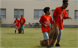 youth having a 3 legged race