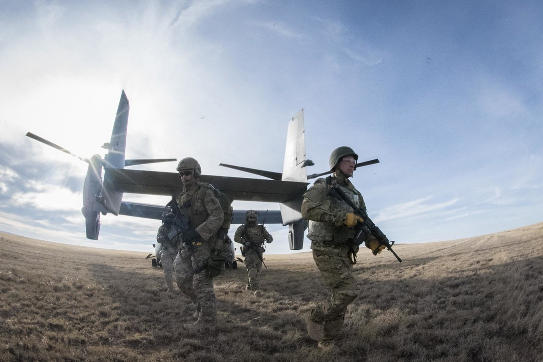 Soliders walking out of an OSPREY