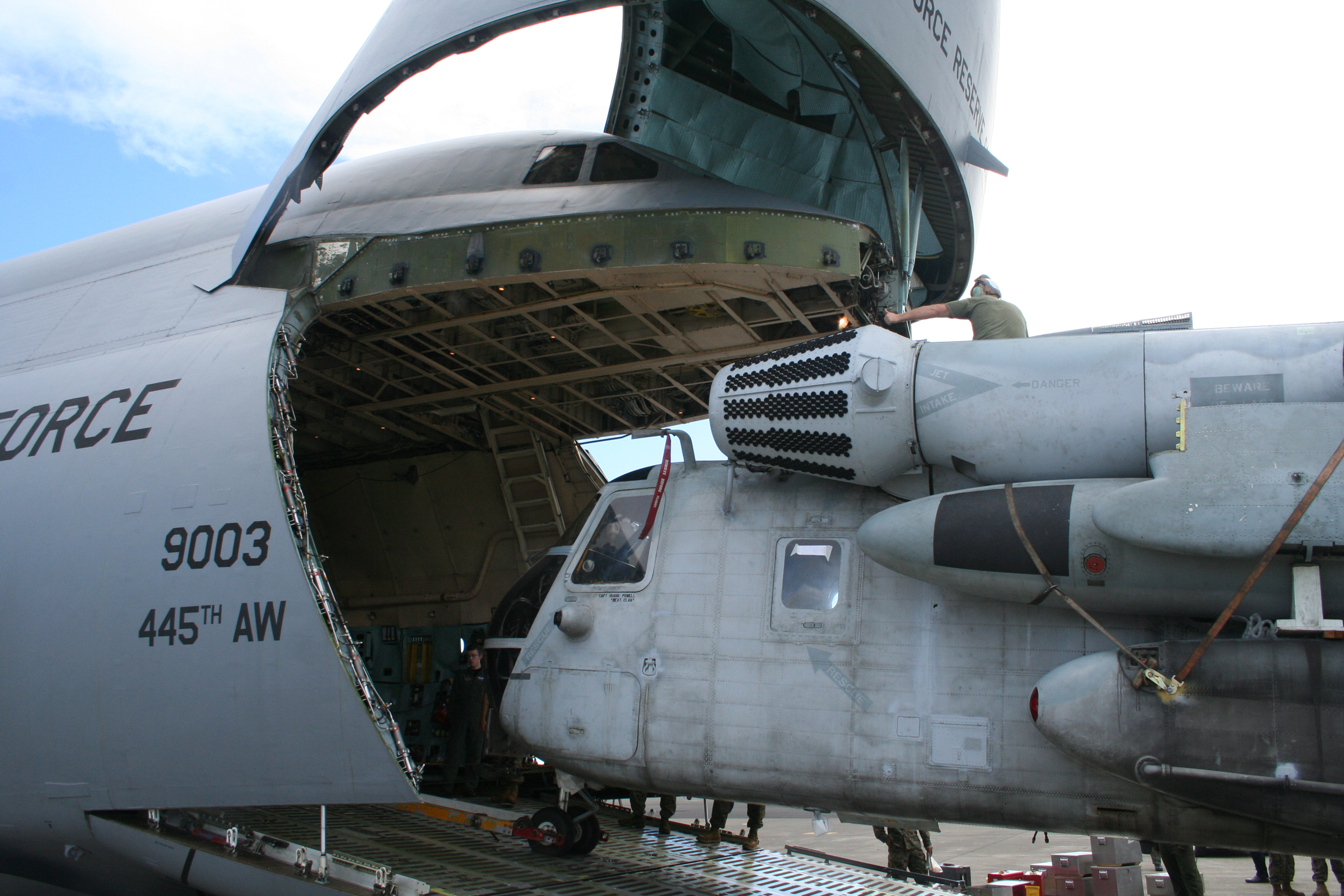 helicopter being loaded into the nose of a C5