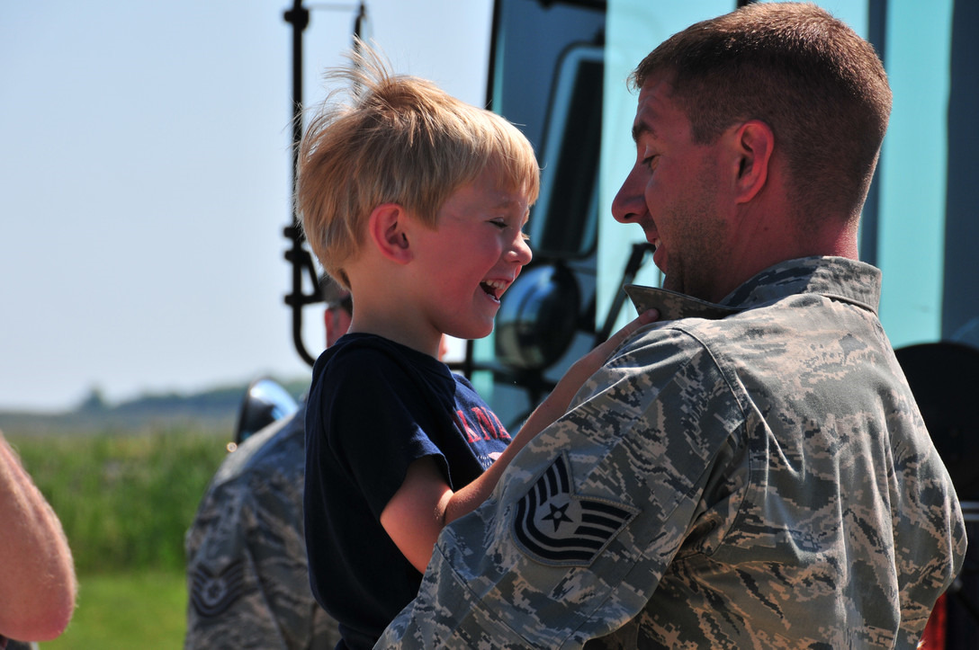 airman holding his son