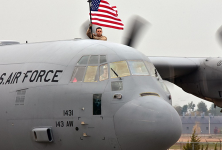 143rd Airlift Wing c130 with american flag flying