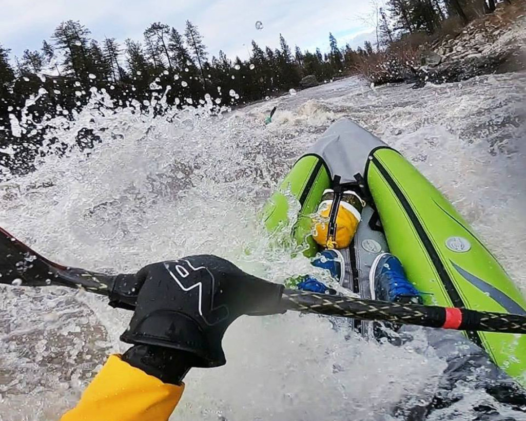 person rafting down a river